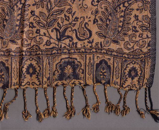 Paisley shawl fringe detail representing fall 2026 fashion trends