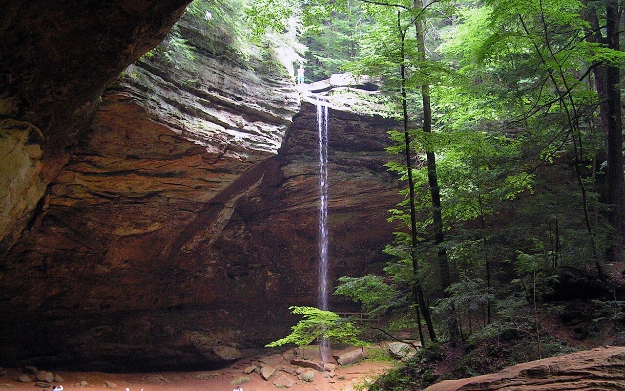 Ash Cave in Hocking Hills State Park, Ohio, with a waterfall dropping from a rock overhang
